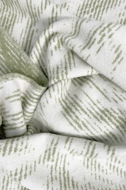 Moooi Blushing Sloth Olive cream Ullpledd, en del av kategorien Pledd - At Home Interiør